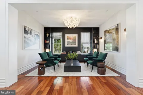 a living room with fireplace furniture and a flat screen tv