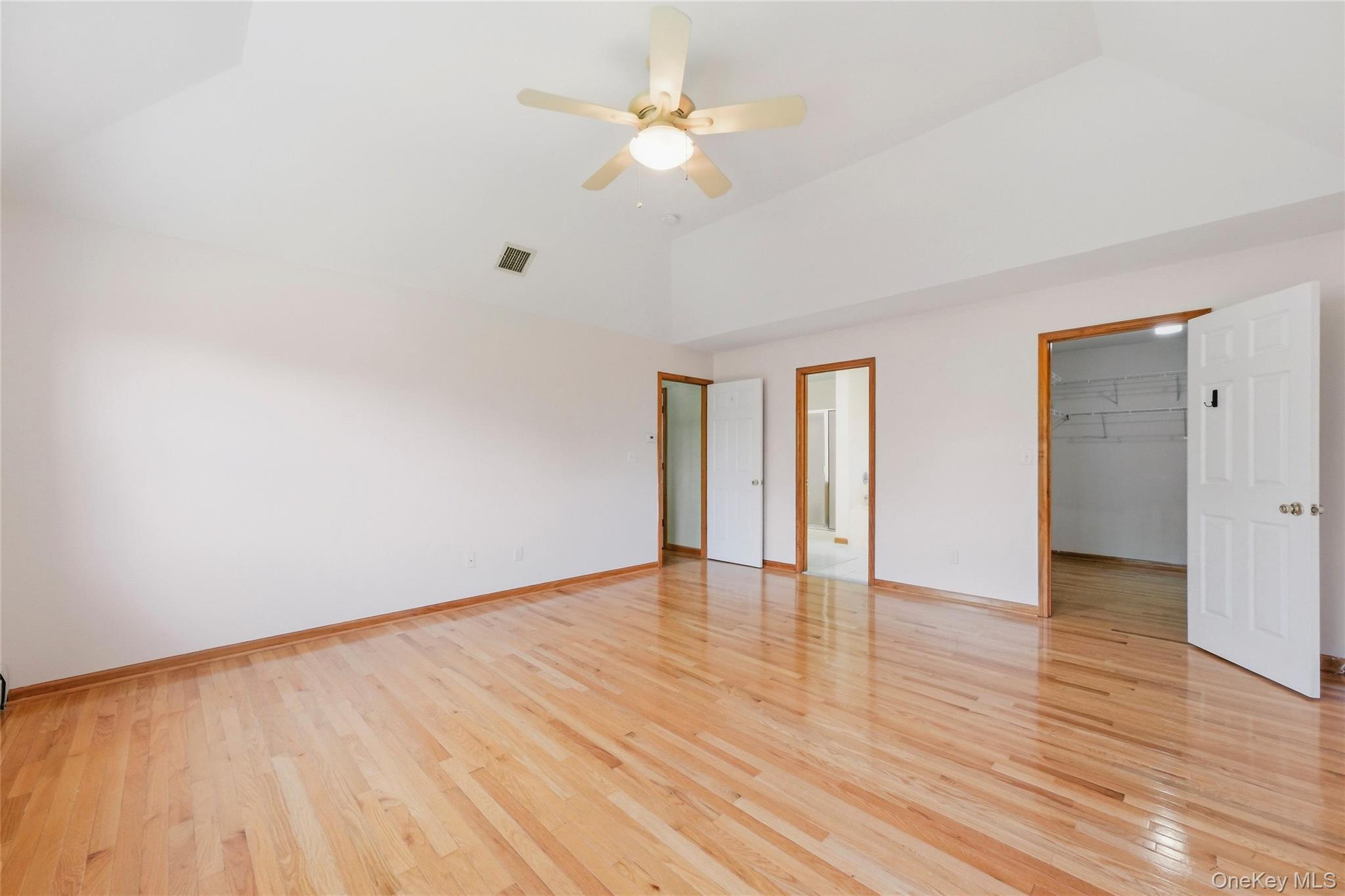 5 Horton Road Washingtonville, NY 10992 - Photo 20 of 42 a view of an empty room with wooden floor and a ceiling fan