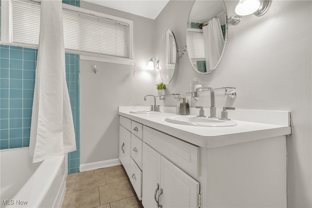 2440 White Road Cleveland, OH 44118 - Photo 31 of 43 Bathroom featuring plus walk in shower, tile patterned floors, and vanity