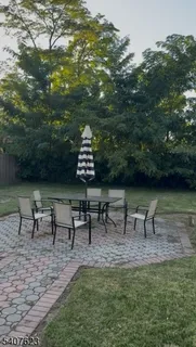 a view of a bench in a backyard