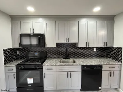 a kitchen with a stove and a microwave