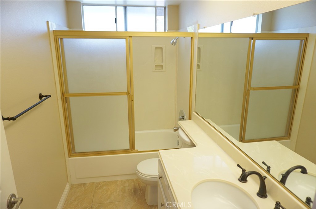 19584 Shadow Glen Circle Porter Ranch, CA 91326 - Photo 38 of 72 a bathroom with a sink and a shower