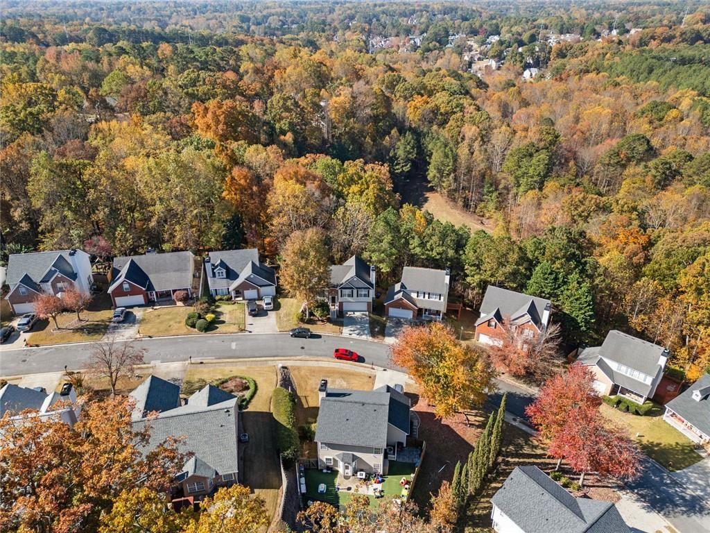 2140 Wildcat Cliffs Way Lawrenceville, GA 30043 - Photo 2 of 32 an aerial view of a building with outdoor space