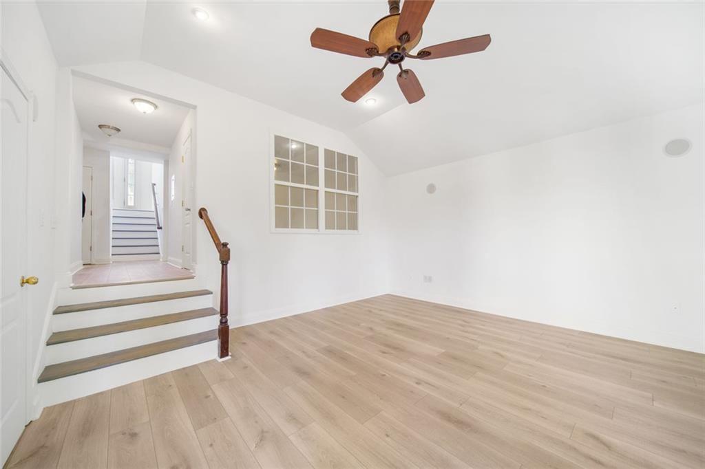 2140 Wildcat Cliffs Way Lawrenceville, GA 30043 - Photo 28 of 32 a view of empty room with wooden floor and fan