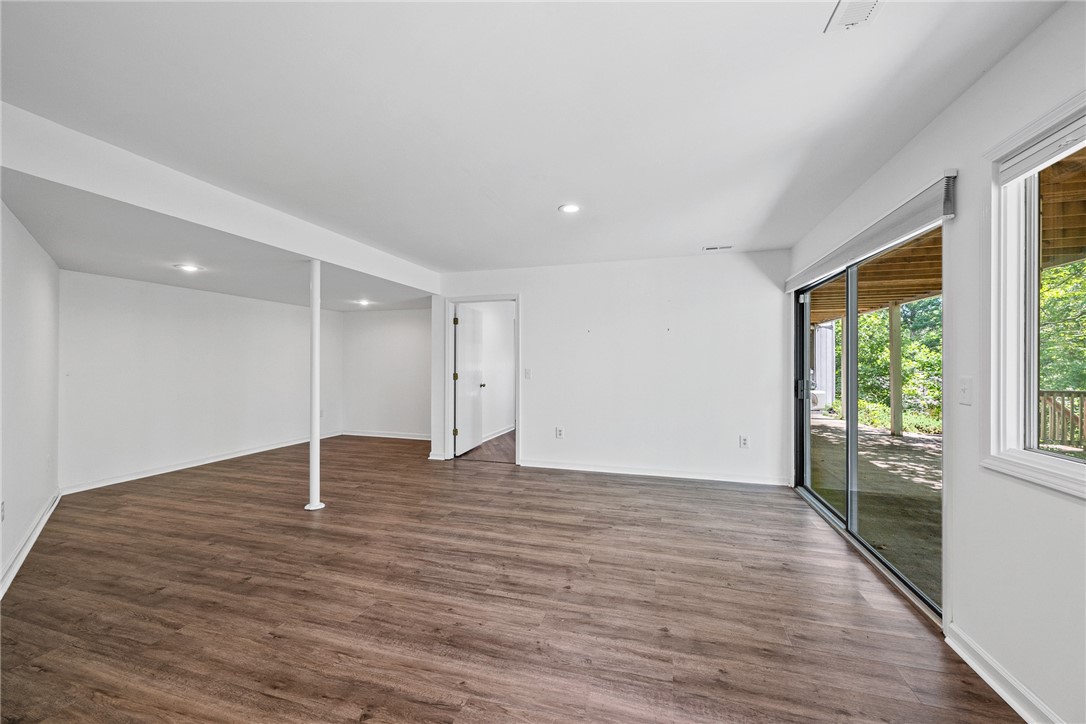 118 Beacon Ridge Circle Salem, SC 29676 - Photo 25 of 45 A spacious, naturally illuminated room featuring durable wood flooring and seamless outdoor access.