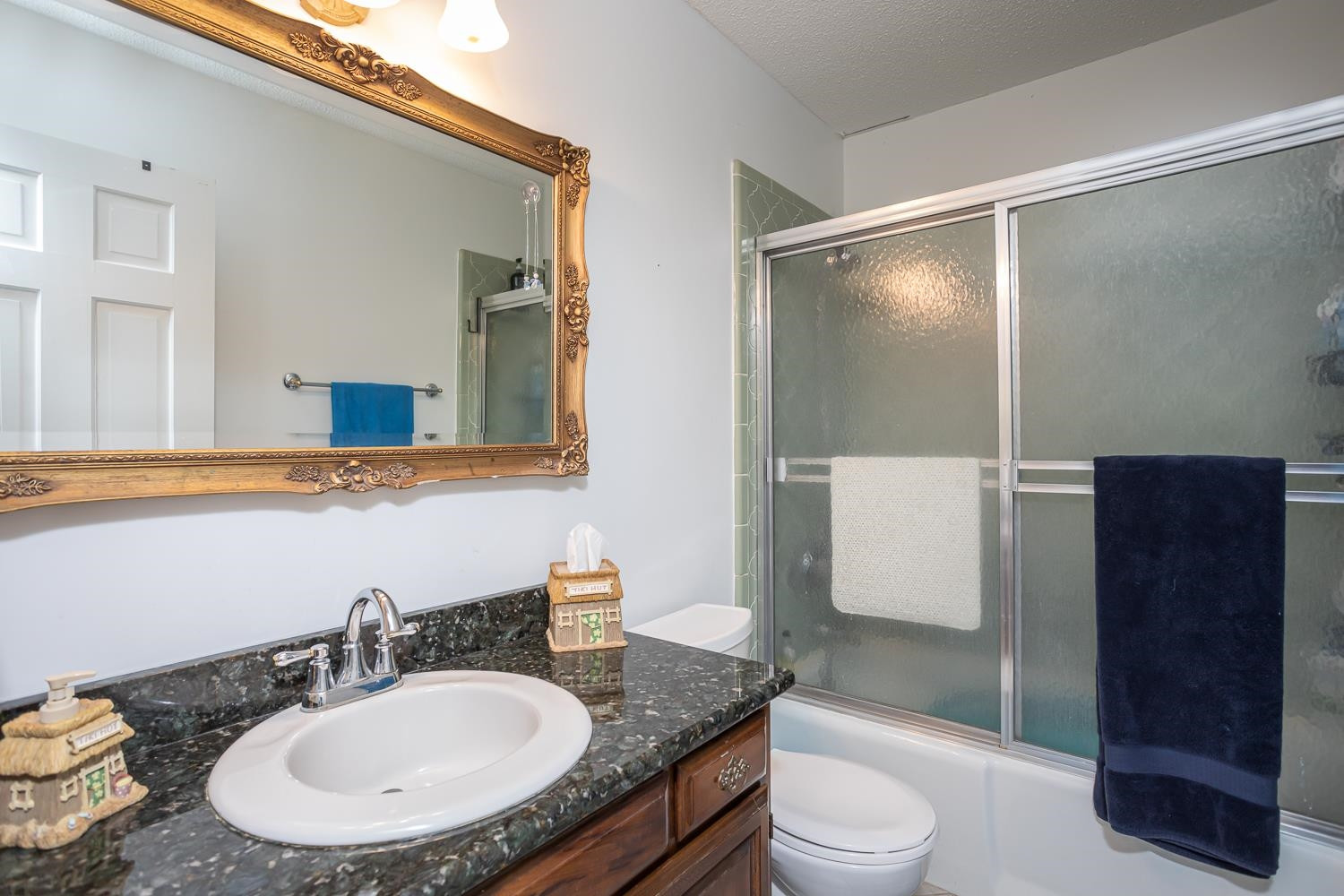 14401 Possum Track Road Raleigh, NC 27614 - Photo 15 of 30 Full bathroom on main level. Granite countertop and tile shower! Bathroom
