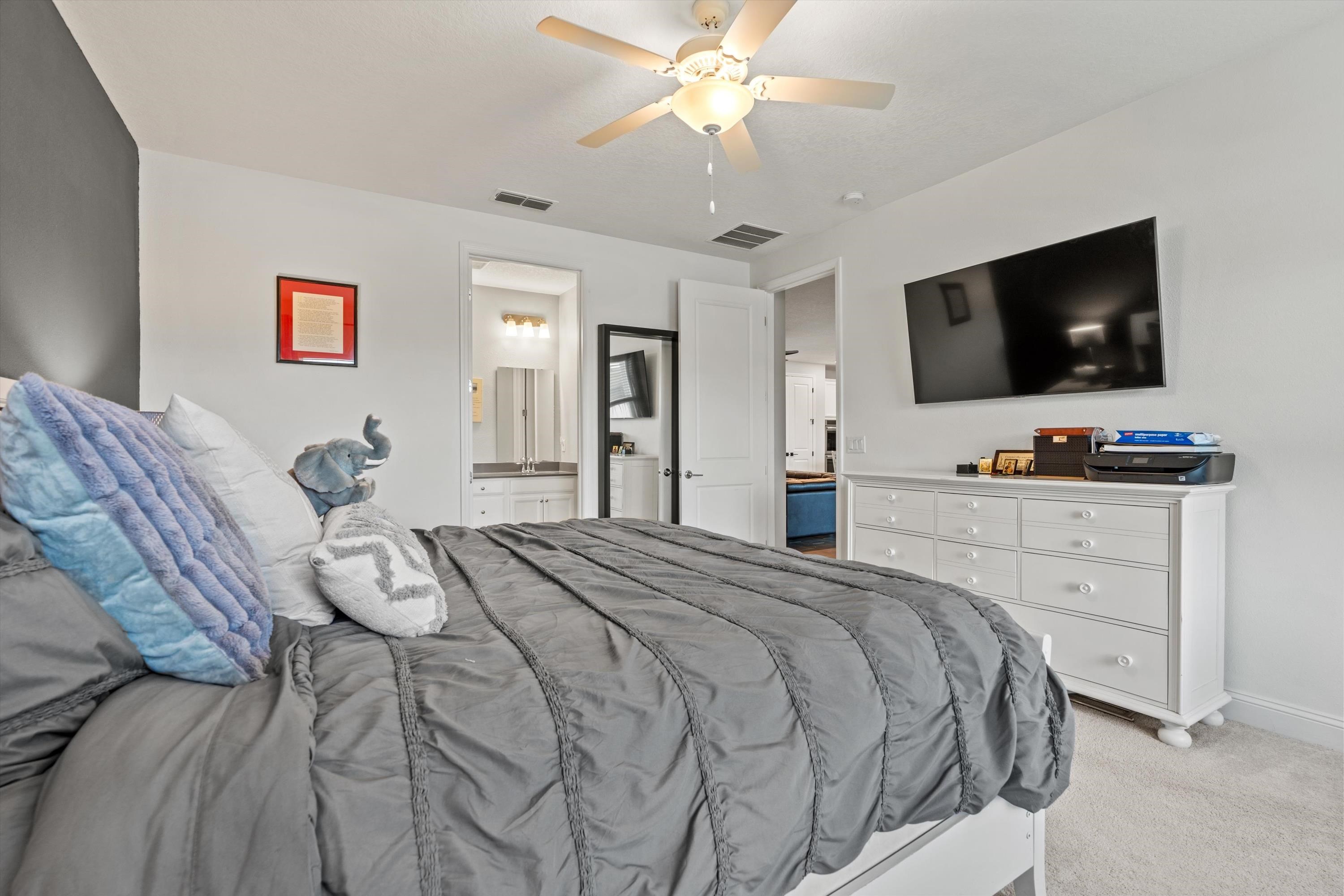 366 Varner Way St. Augustine, FL 32092 - Photo 17 of 50 a bedroom with a bed and a flat screen tv