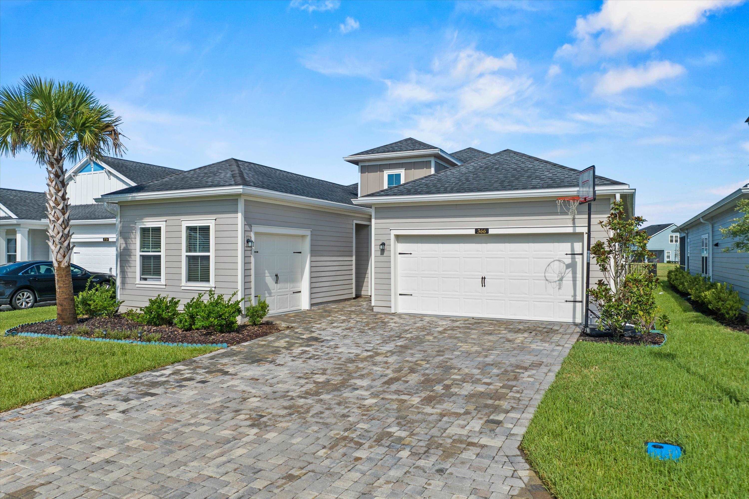 366 Varner Way St. Augustine, FL 32092 - Photo 2 of 50 a front view of a house with a yard and garage