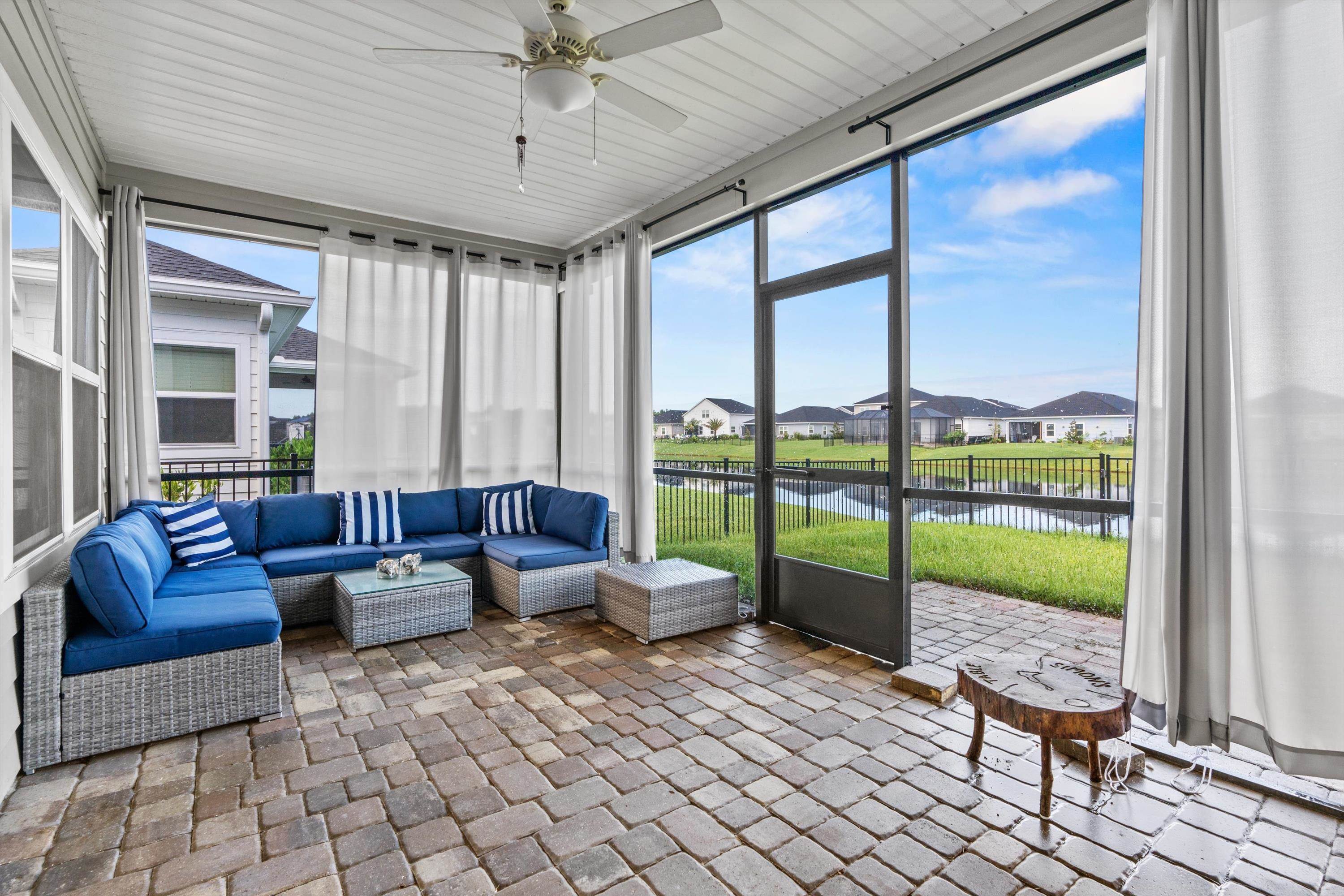 366 Varner Way St. Augustine, FL 32092 - Photo 4 of 50 a living room with furniture and a floor to ceiling window