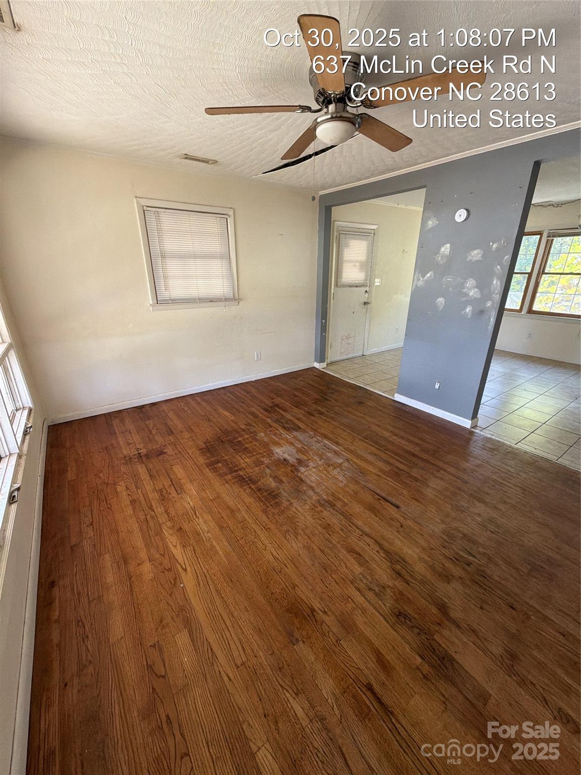 637 McLin Creek Road North Conover, NC 28613 - Photo 5 of 13 a view of an empty room with wooden floor and a window