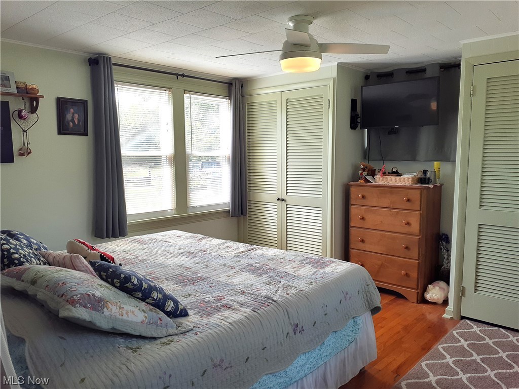 39981 Butternut Ridge Road Elyria, OH 44035 - Photo 12 of 20 Hardwood floored bedroom featuring ceiling fan and crown molding
