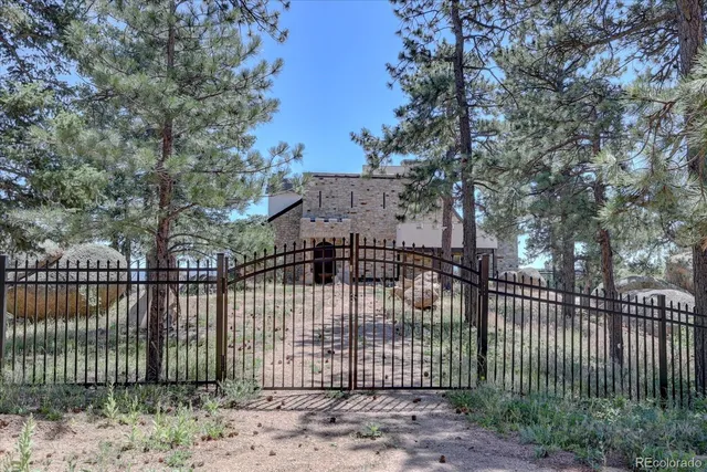 a view of a wrought iron fences in front of house