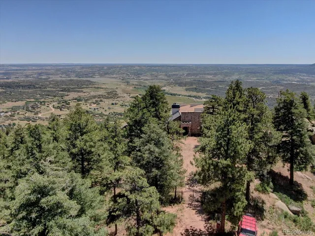an aerial view of residential building and green space