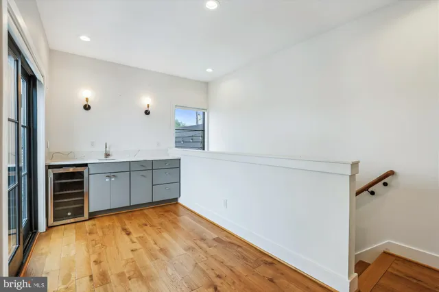 a room with a bed and cabinets