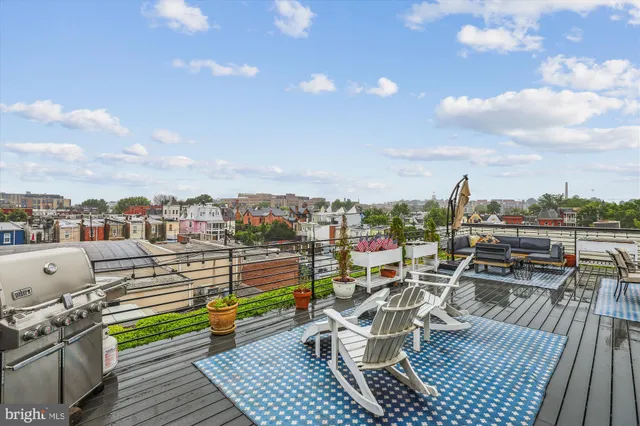 a view of roof deck with seating space and barbeque oven