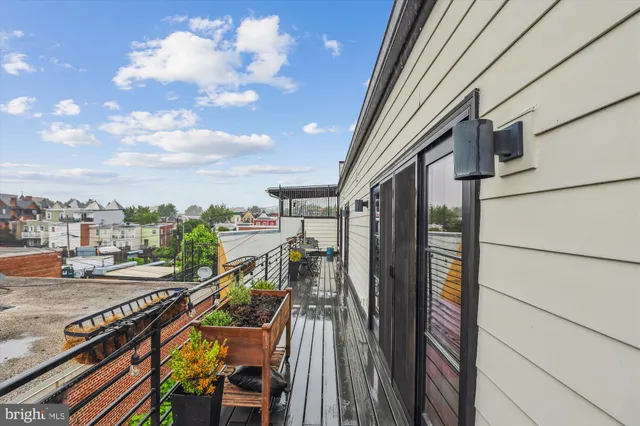 a view of a balcony with furniture