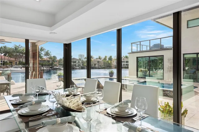 a bathroom with a double vanity sink mirror and shower
