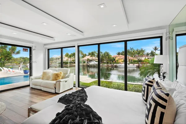 a bedroom with two beds and a chandelier