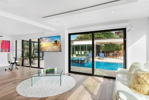 a living room with furniture and a window