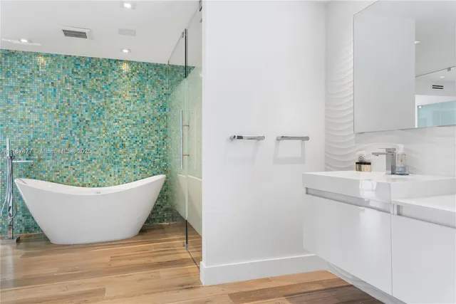 a view of a house with pool and sitting area