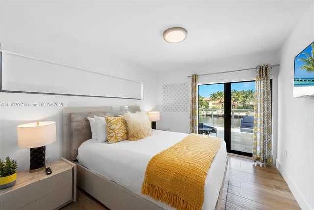 an aerial view of a house with outdoor space and lake view