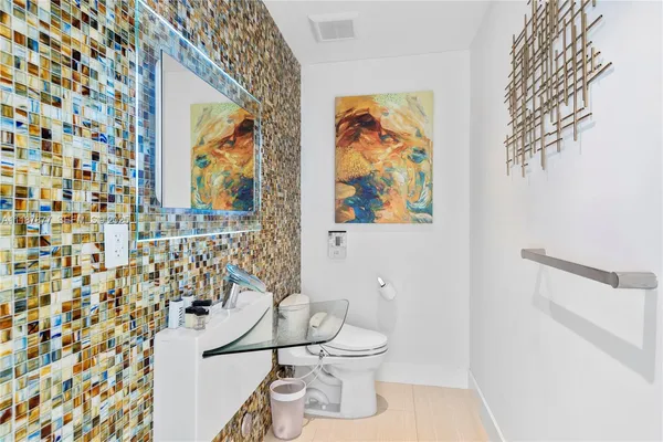 an aerial view of residential houses with outdoor space and river