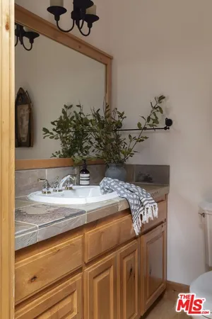 a bathroom with a sink and mirror