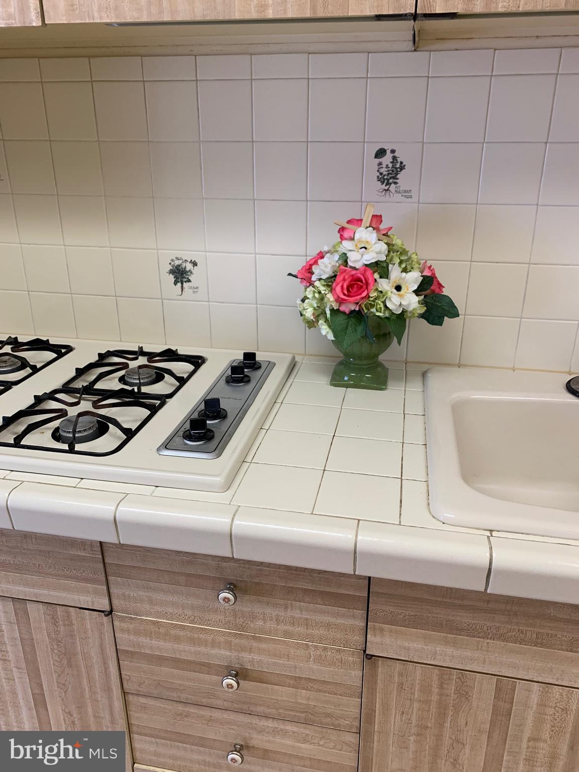 801 Yale Avenue, Unit 207 Swarthmore, PA 19081 - Photo 19 of 35 a kitchen with a sink and cabinets