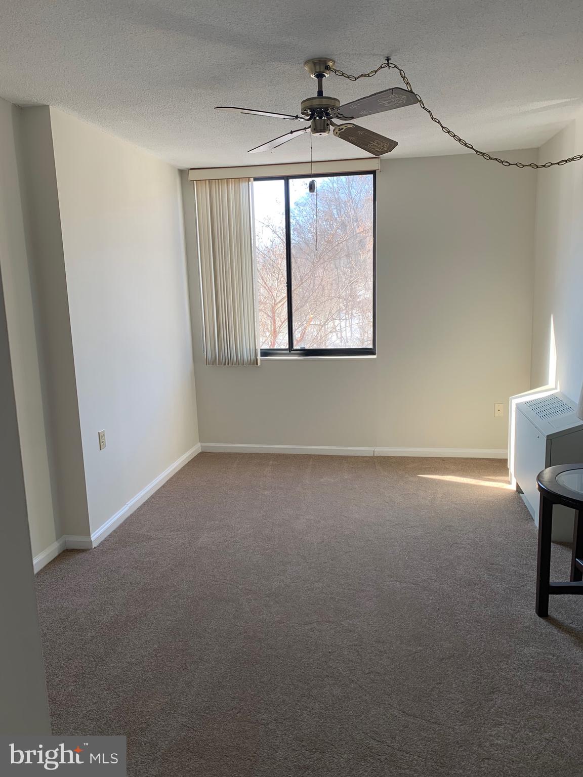 801 Yale Avenue, Unit 207 Swarthmore, PA 19081 - Photo 22 of 35 a view of empty room with windows and fan