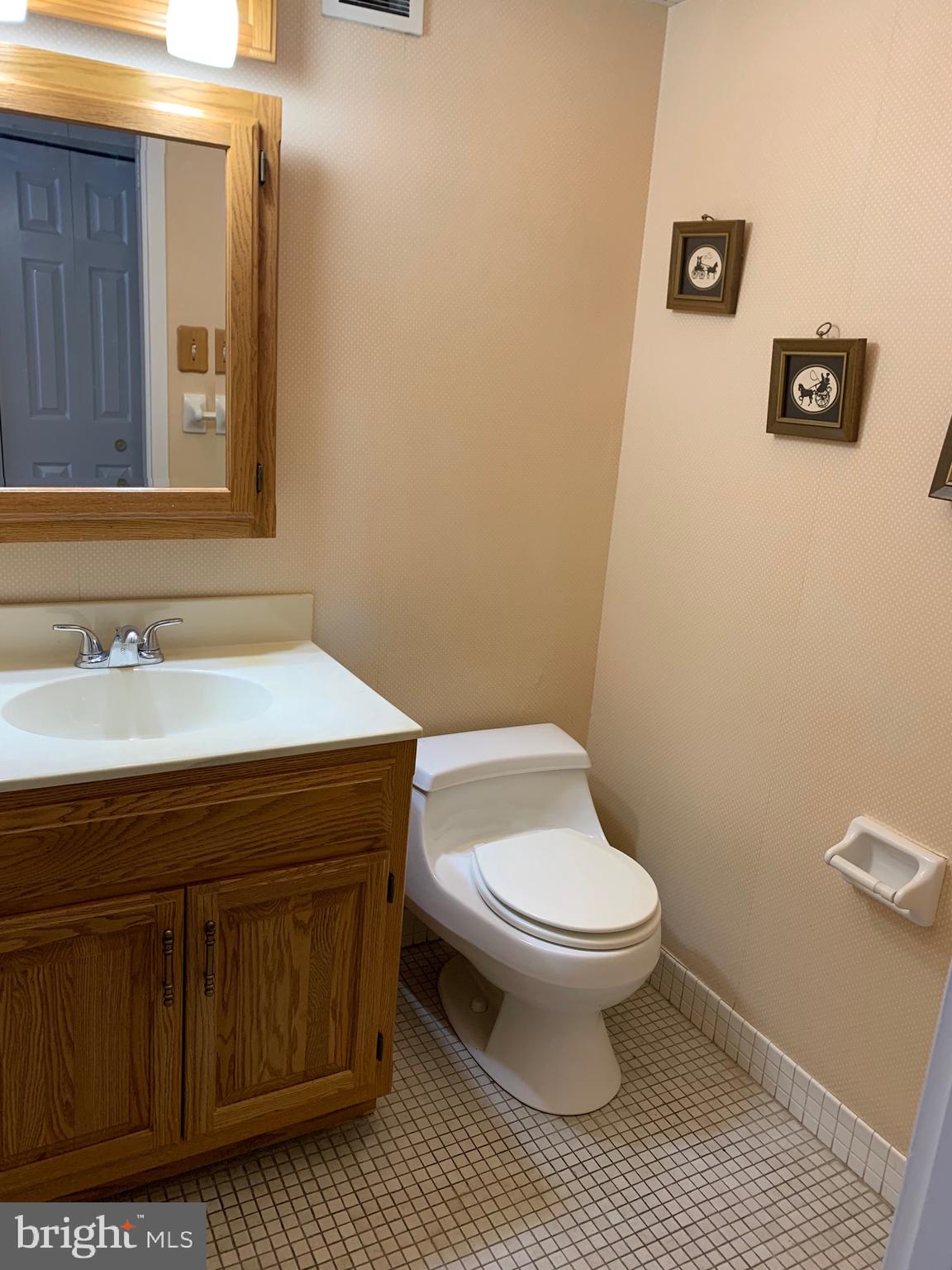 801 Yale Avenue, Unit 207 Swarthmore, PA 19081 - Photo 28 of 35 a bathroom with a toilet a sink and mirror