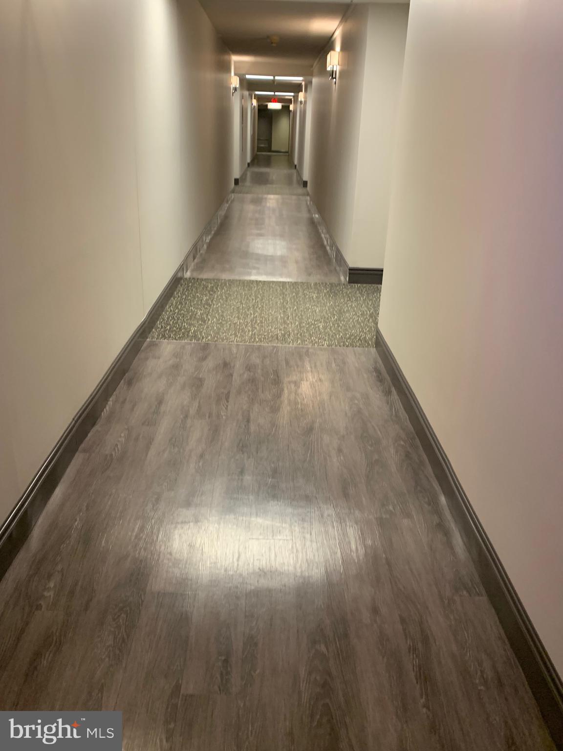 801 Yale Avenue, Unit 207 Swarthmore, PA 19081 - Photo 3 of 35 a view of a hallway view with wooden floor