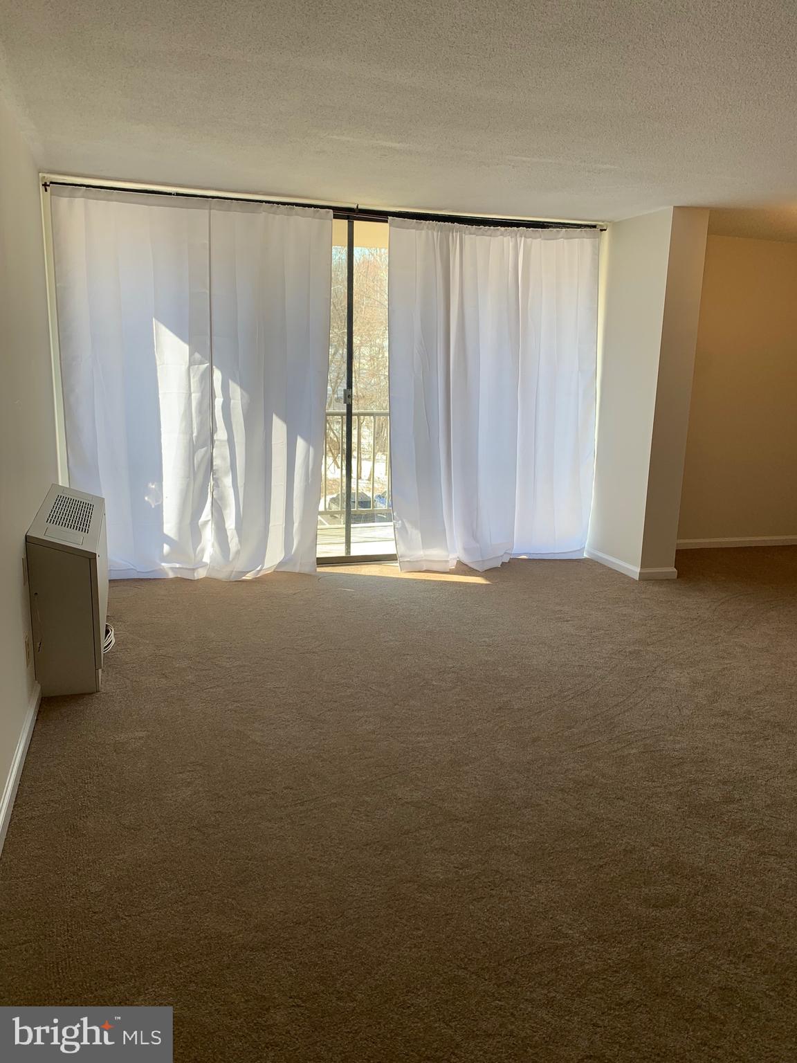 801 Yale Avenue, Unit 207 Swarthmore, PA 19081 - Photo 6 of 35 a view of an empty room with a window