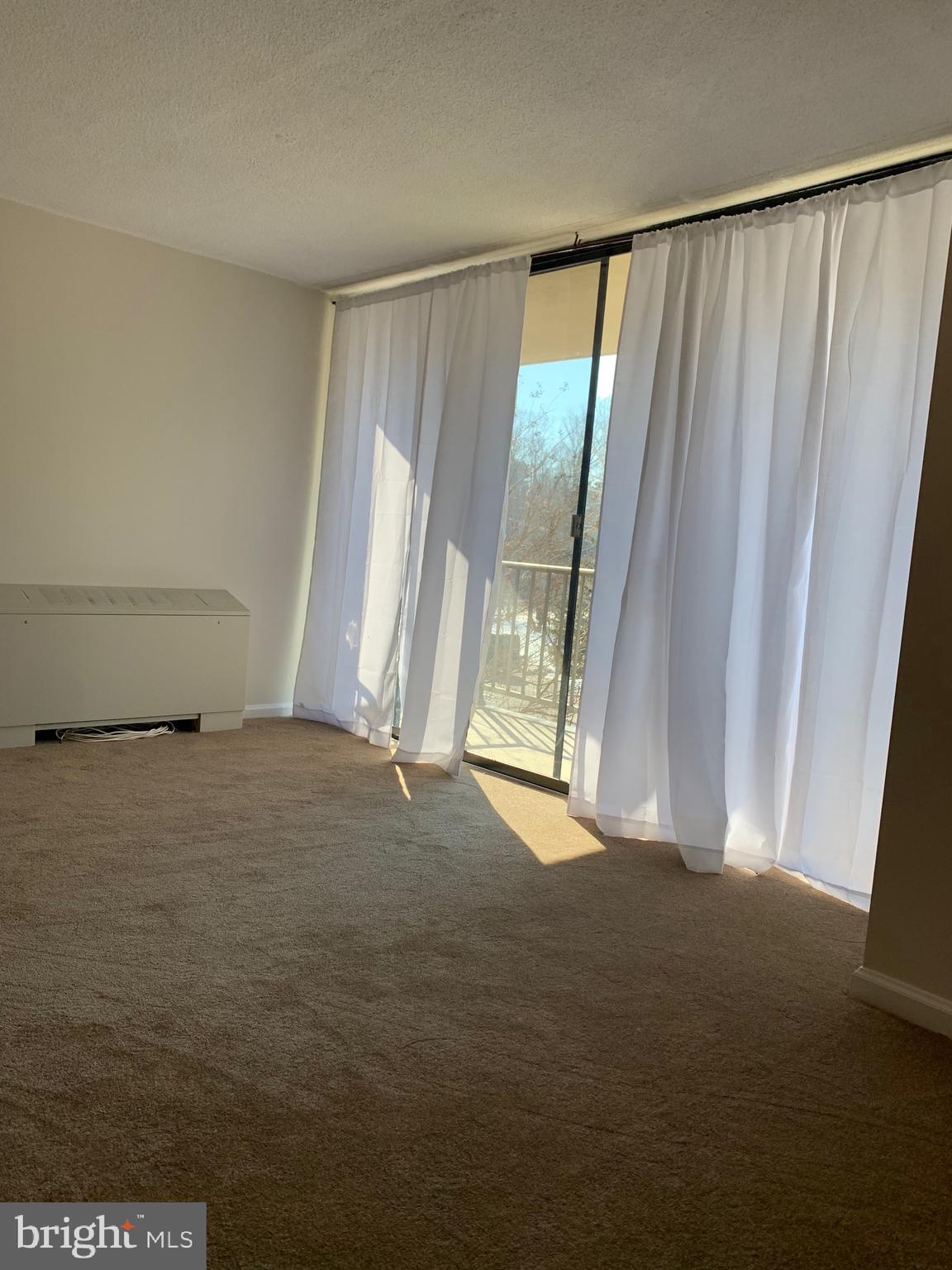 801 Yale Avenue, Unit 207 Swarthmore, PA 19081 - Photo 7 of 35 a view of an empty room with a window