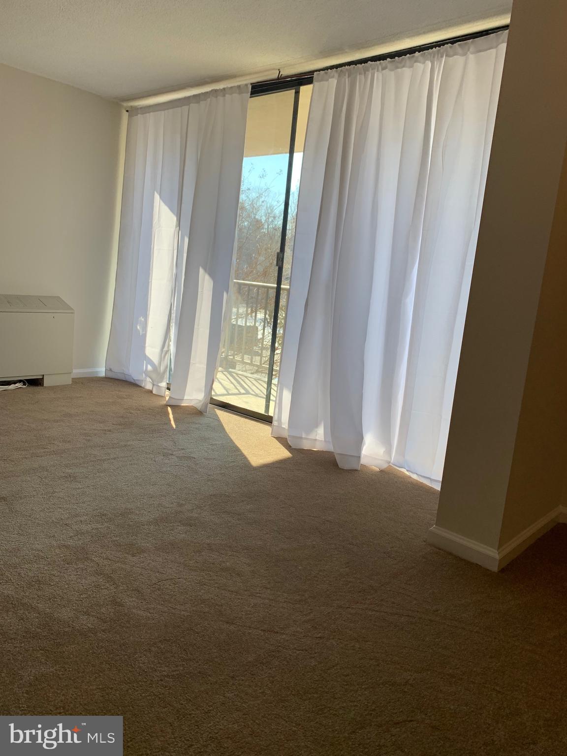 801 Yale Avenue, Unit 207 Swarthmore, PA 19081 - Photo 8 of 35 a view of an empty room with a window