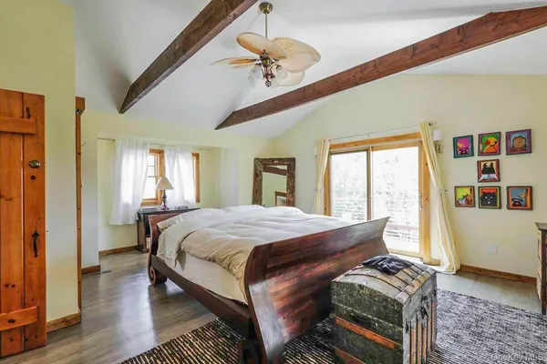 a bed room with a bed and a chandelier