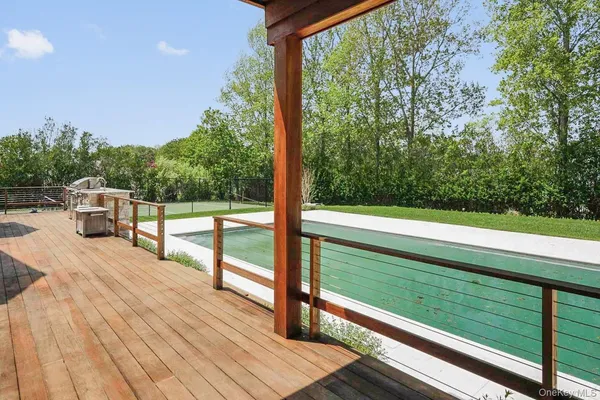 a view of outdoor space with deck and yard