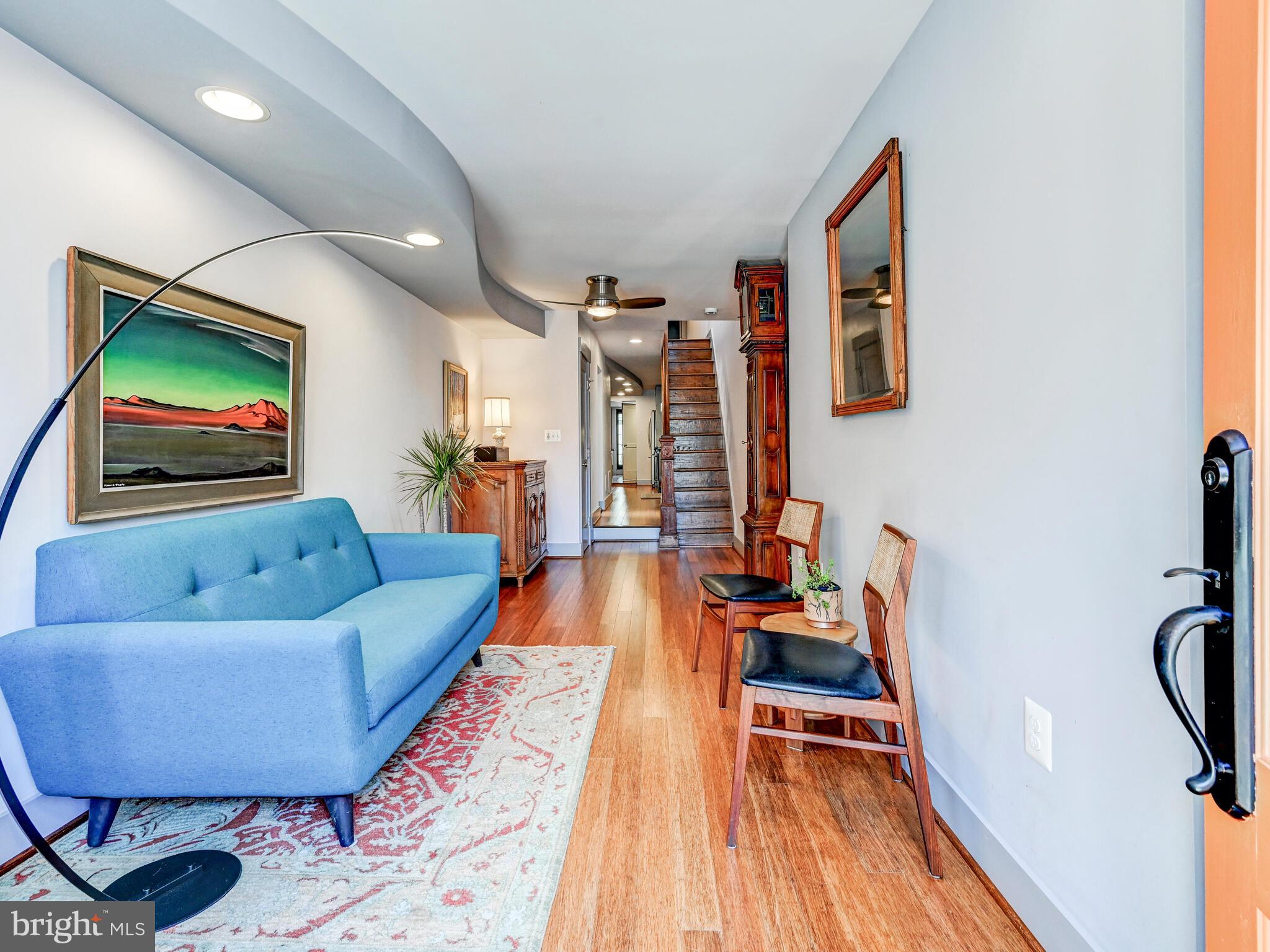 325 South Castle Street Baltimore, MD 21231 - Photo 2 of 31 a living room with furniture and a flat screen tv