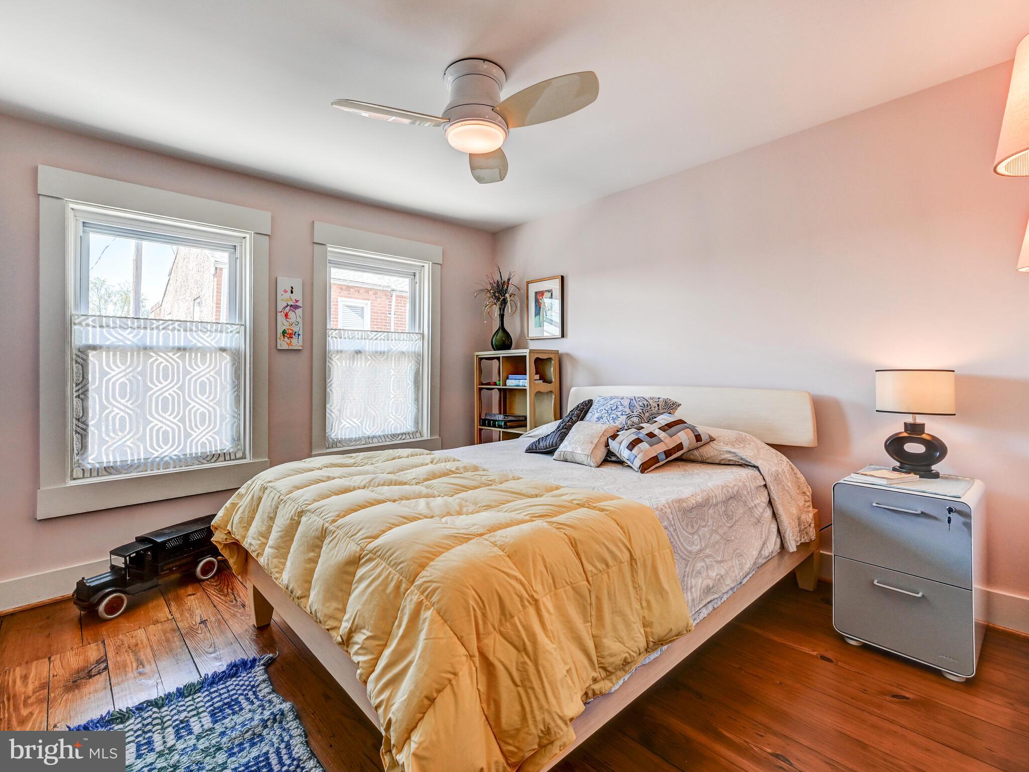 325 South Castle Street Baltimore, MD 21231 - Photo 22 of 31 a bedroom with a bed and a dresser