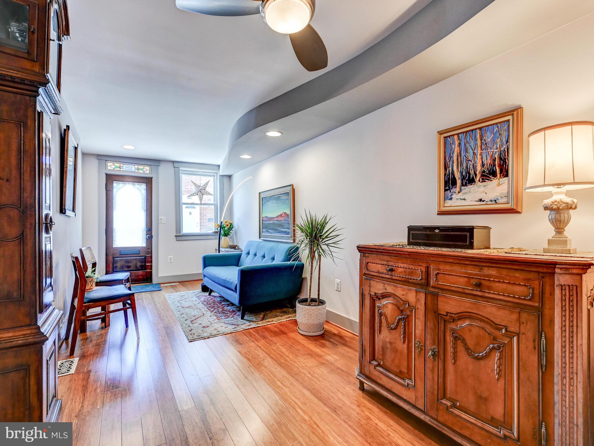 325 South Castle Street Baltimore, MD 21231 - Photo 4 of 31 a living room with furniture and wooden floor