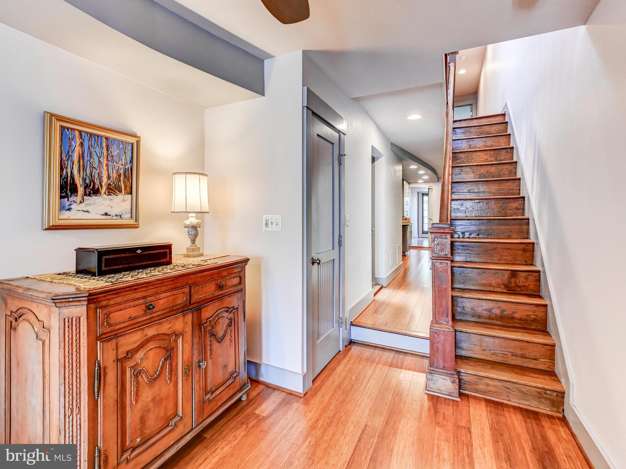 325 South Castle Street Baltimore, MD 21231 - Photo 5 of 31 a view of a hallway with wooden floor and staircase