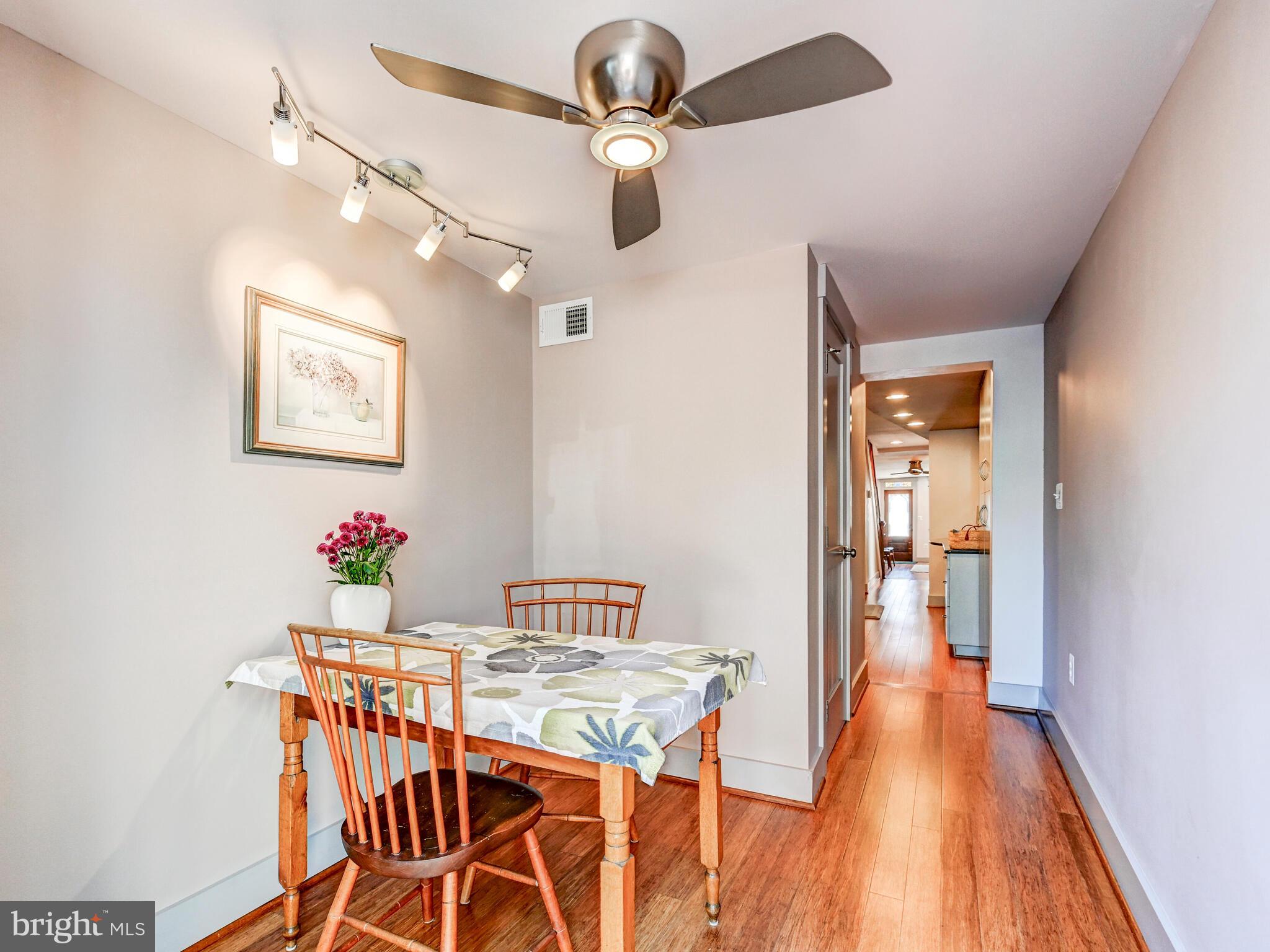 325 South Castle Street Baltimore, MD 21231 - Photo 10 of 31 a view of a dining room with furniture and wooden floor