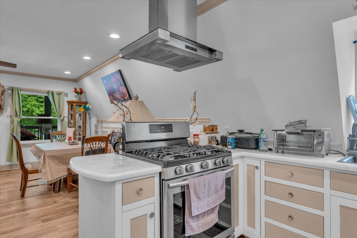 475 Lost Creek Road Lynchburg, TN 37352 - Photo 12 of 34 a kitchen with stainless steel appliances granite countertop a stove and a sink