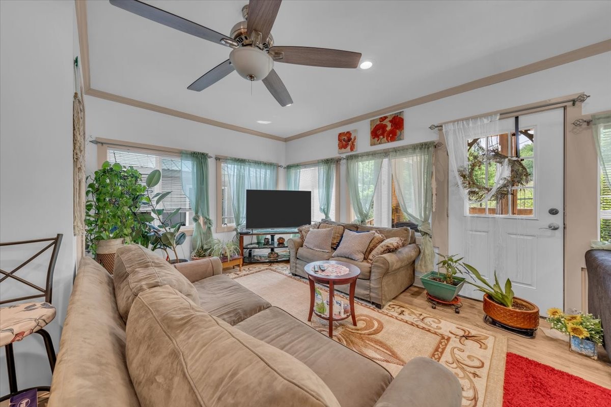 475 Lost Creek Road Lynchburg, TN 37352 - Photo 18 of 34 a living room with furniture and a flat screen tv