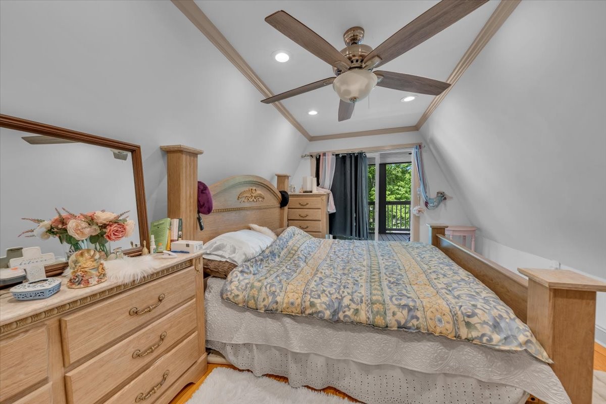 475 Lost Creek Road Lynchburg, TN 37352 - Photo 22 of 34 a bedroom with a large bed and a large dresser