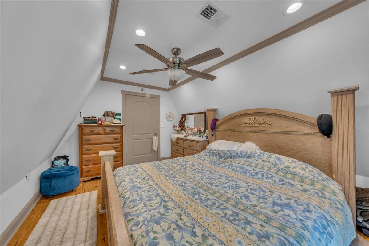 475 Lost Creek Road Lynchburg, TN 37352 - Photo 23 of 34 a bedroom with a bed and a dresser