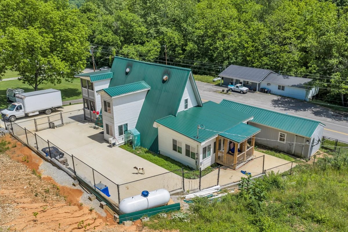 475 Lost Creek Road Lynchburg, TN 37352 - Photo 31 of 34 an aerial view of a house with swimming pool and big yard
