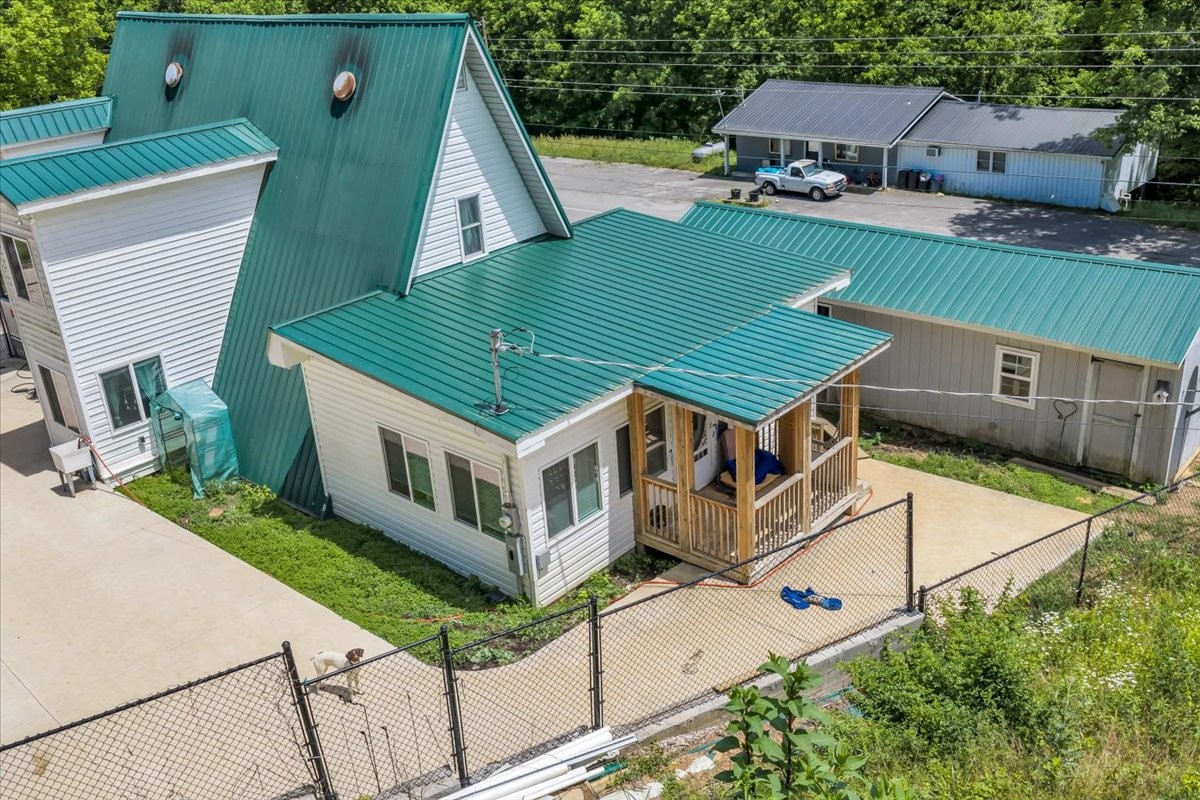 475 Lost Creek Road Lynchburg, TN 37352 - Photo 4 of 34 an aerial view of a house with roof deck