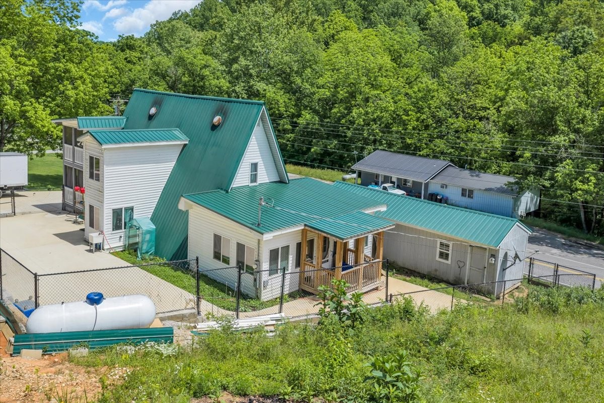 475 Lost Creek Road Lynchburg, TN 37352 - Photo 5 of 34 an aerial view of a house with swimming pool garden and patio