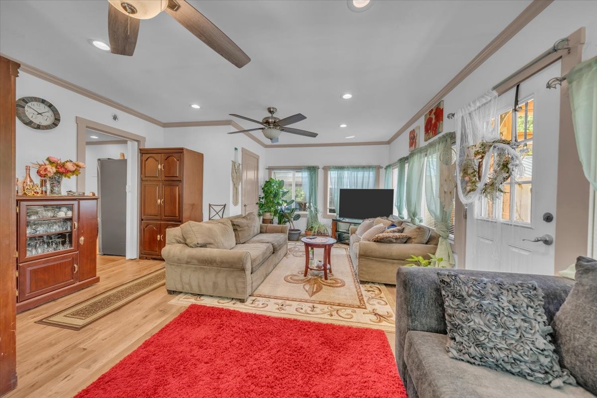475 Lost Creek Road Lynchburg, TN 37352 - Photo 10 of 34 a living room with furniture and a flat screen tv