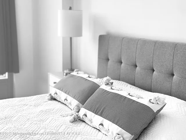 a kitchen with a table chairs refrigerator and cabinets